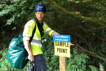 Environment Agency inspector-  sampling to check compliance at nearby water company site