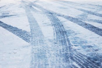SNOW ROAD TYRE TRACKS