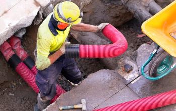 Underground pipes construction worker